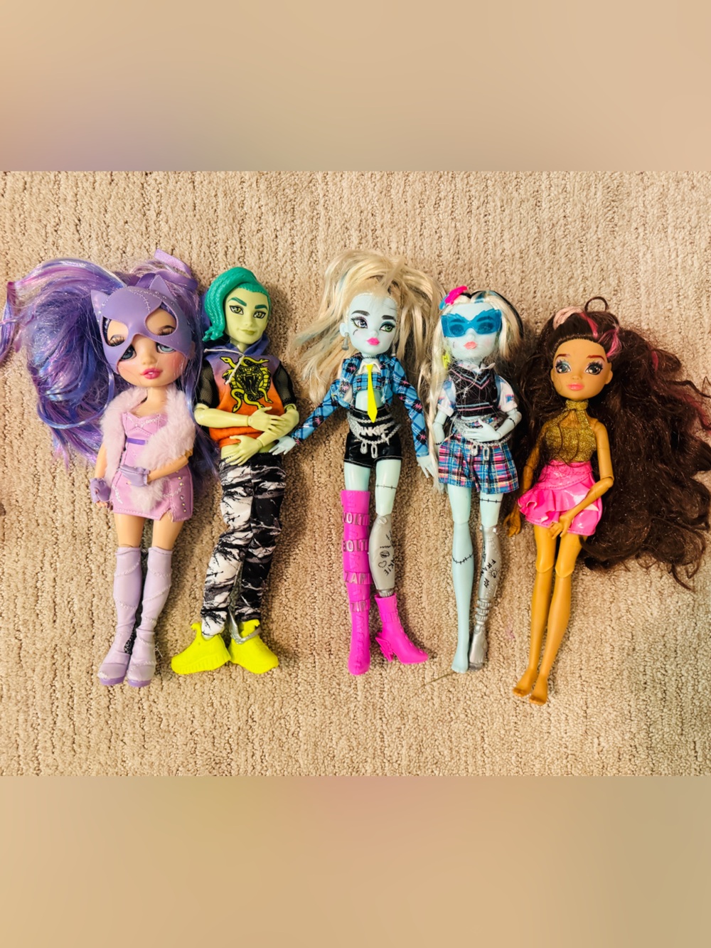 monster high dolls set with purple pink teal blue and yellow accents
